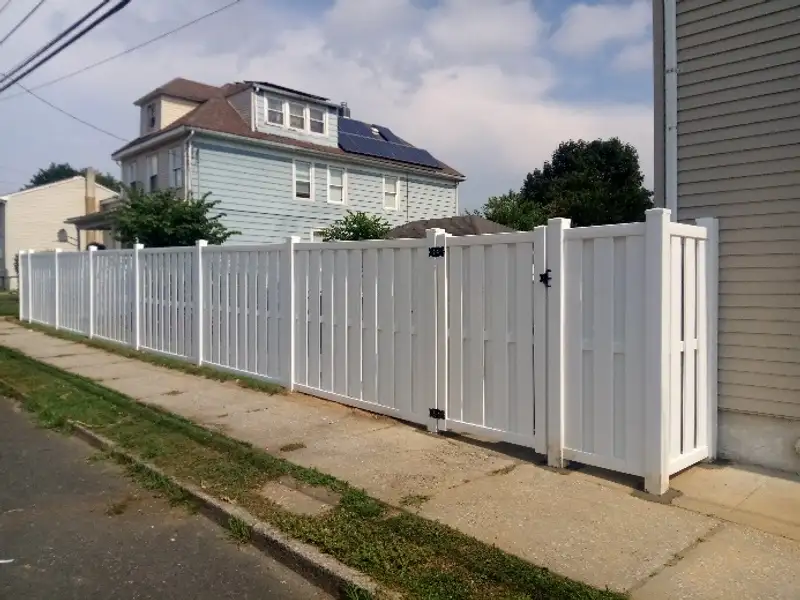 White vinyl residential fence installation by Fencing By Excellence near Keyport, Monmouth County NJ