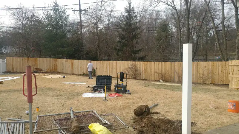 Wood privacy fence installation in progress by Fencing By Excellence near Hazlet, Monmouth County NJ