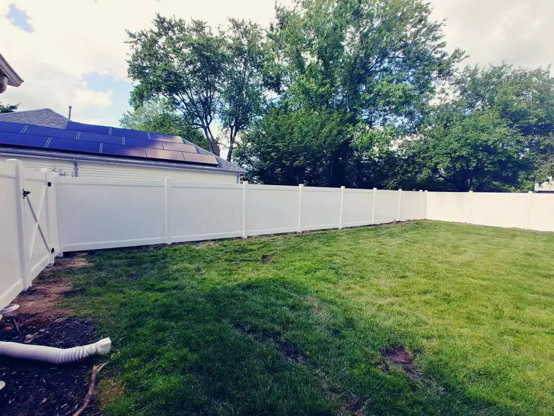 Vinyl fencing along property line by Fencing By Excellence near Keyport, Monmouth County NJ