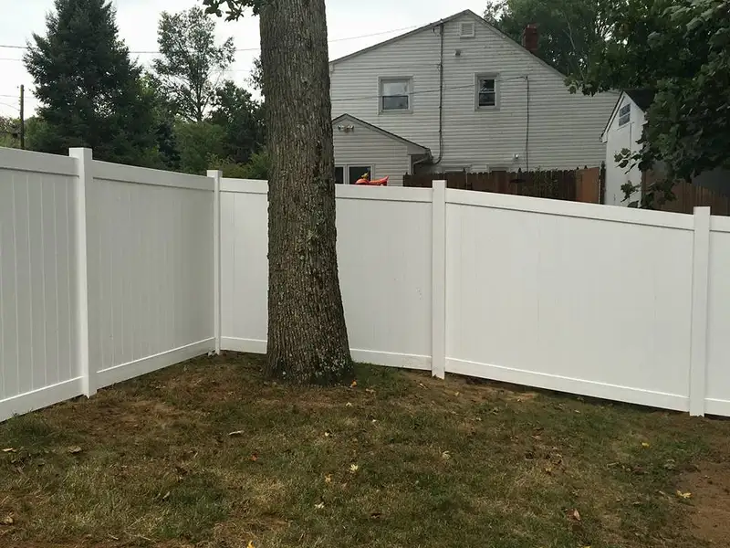 White vinyl privacy fence around yard by Fencing By Excellence near Aberdeen, Monmouth County NJ