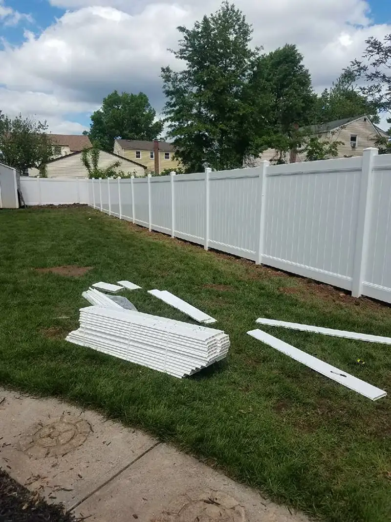Vinyl fence installation near trees by Fencing By Excellence near Keyport, Monmouth County NJ