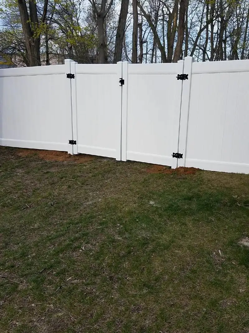 White vinyl fence with landscape border by Fencing By Excellence near Rumson, Monmouth County NJ