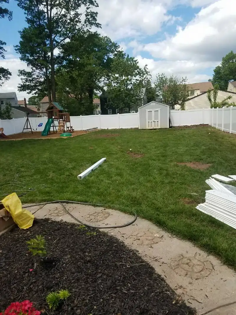 Vinyl privacy fence along driveway by Fencing By Excellence near Matawan, Monmouth County NJ