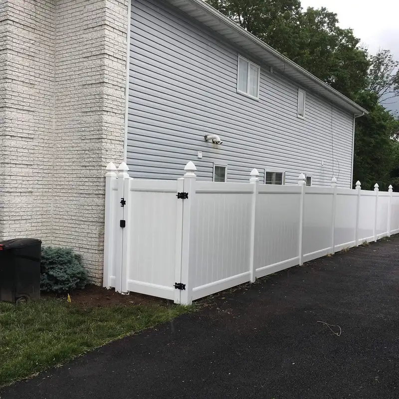 White vinyl privacy fence with gate and black hardware by Fencing By Excellence near Red Bank, Monmouth County NJ