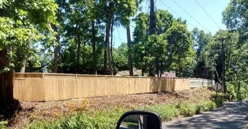 Wood fence in wooded residential setting by Fencing By Excellence near Hazlet, Monmouth County NJ