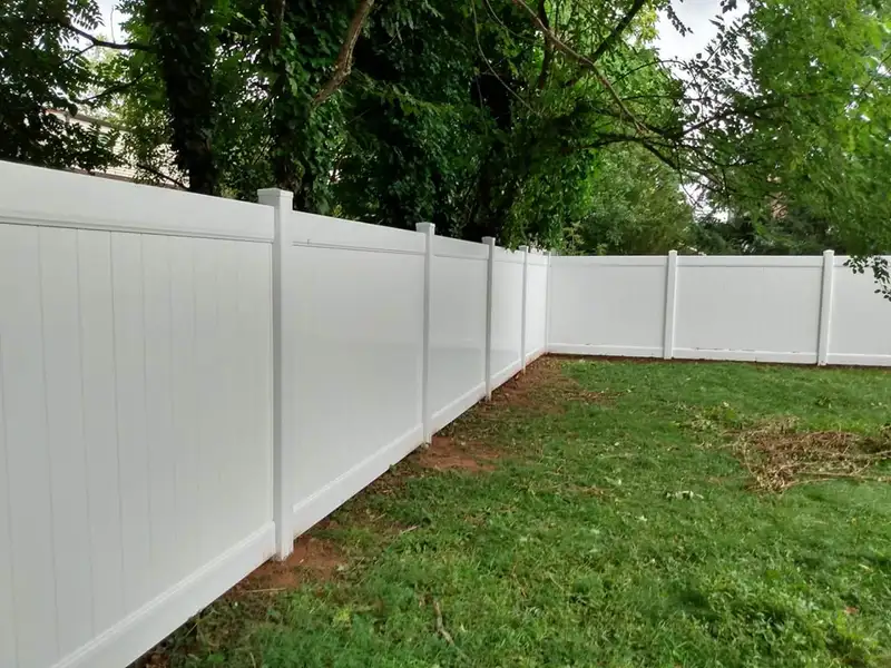 Chain link fence with gate in residential yard by Fencing By Excellence near Matawan, Monmouth County NJ