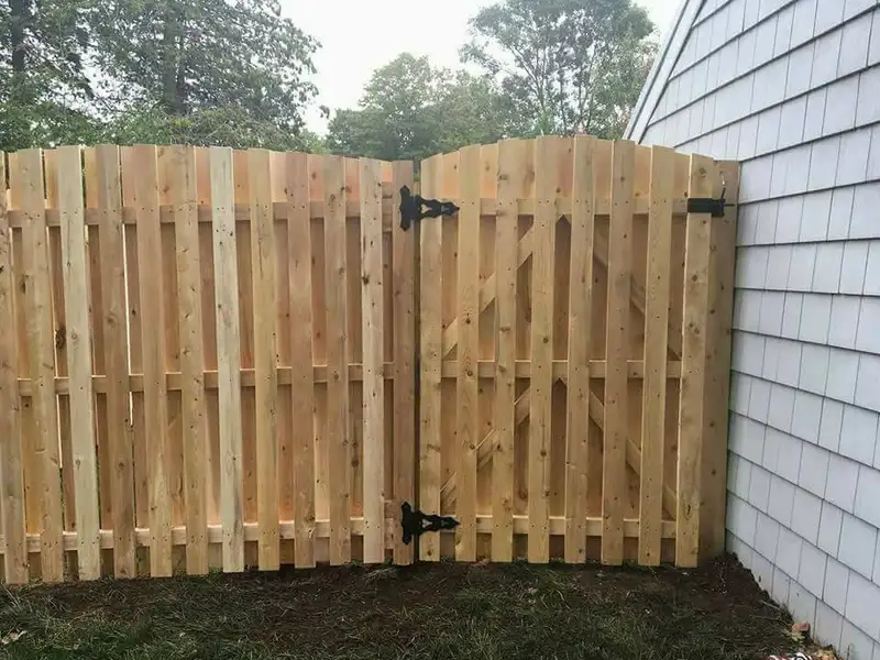 Wood gate installation with black hardware by Fencing By Excellence near Matawan, Monmouth County NJ