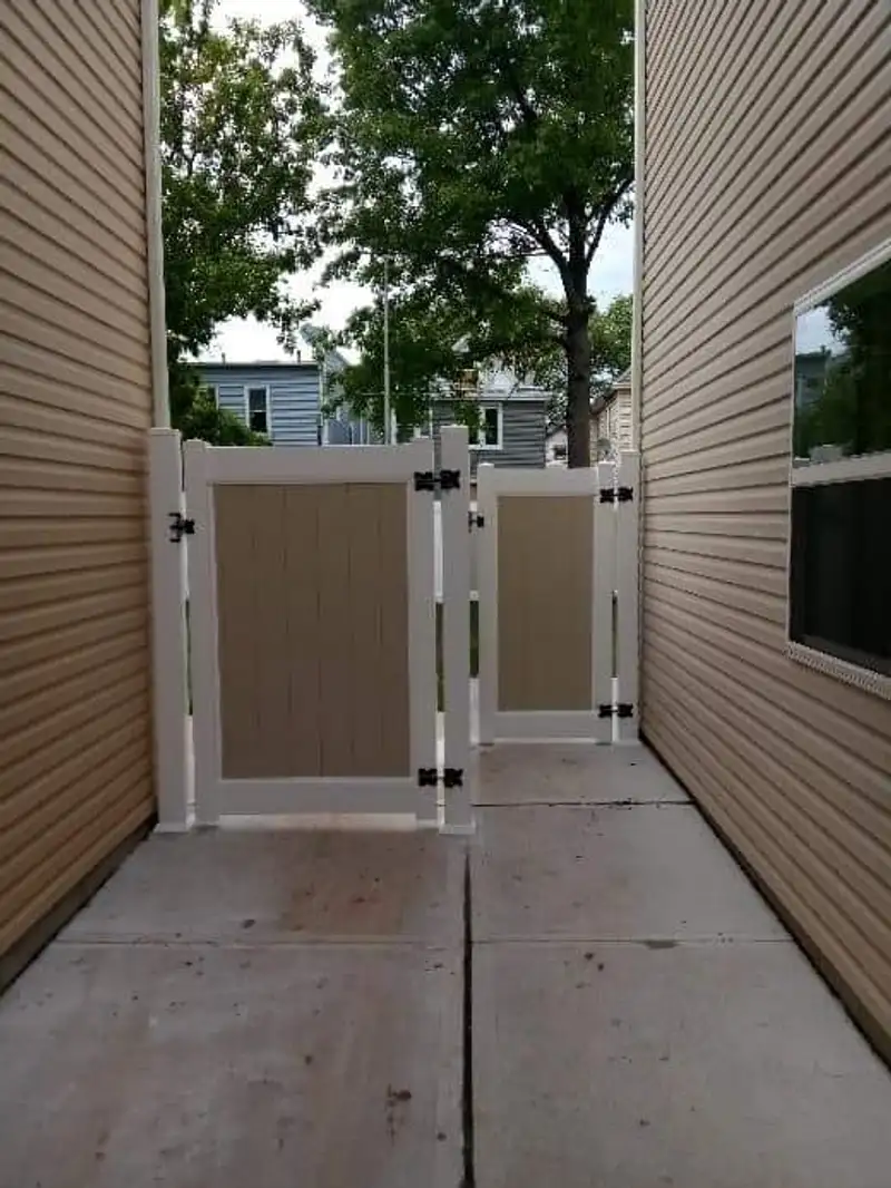 White vinyl privacy fence with gate by Fencing By Excellence near Matawan, Monmouth County NJ
