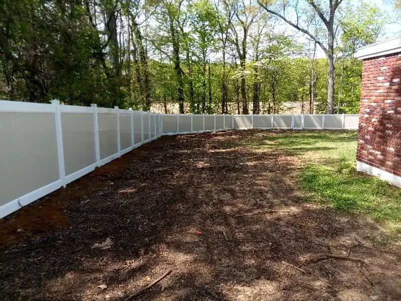 Scalloped vinyl picket fence installation by Fencing By Excellence near Keyport, Monmouth County NJ
